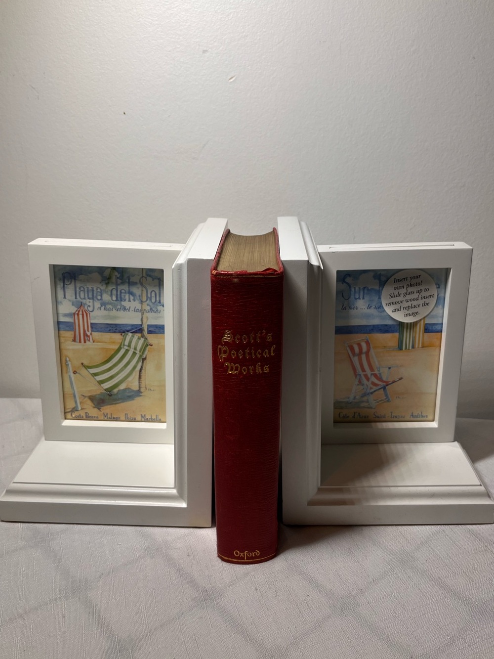 Book ends that hold 3x5 photos
Wooden painted white
Neutral coastal